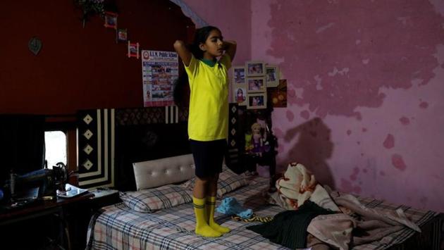Ekampreet, 10, gets ready to go to school at her house. Sarbjeet was married to Daler Singh, who went to South America first, then Mexico. She sold her jewelry for almost $5,000 to help him cross into the United States in late 2010 and borrowed $3,600 from her parents to help him enter Canada in 2014. She wanted her daughter, Ekampreet, to study in Canada, so she pawned her cousins’, aunts’ and friends’ jewelry for $700, too. (Anushree Fadnavis / REUTERS)