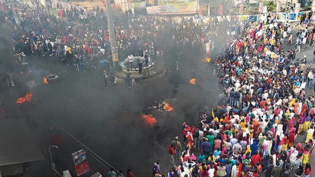 College students along with locals burn tyres during their protest strike against the Citizenship Amendment Bill (CAB), in Tinsukia district of Assam on Wednesday.(Photo: PTI) College students along with locals burn tyres during their protest strike against the Citizenship Amendment Bill (CAB), in Tinsukia district of Assam on Wednesday.(Photo: PTI)