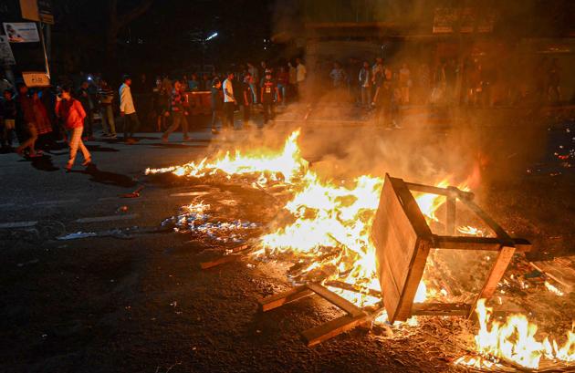 Protestors burn tyres and public property on road during a protest against the Citizenship (Amendment) Bill, 2019, in Guwahati on Wednesday.(PTI) Protestors burn tyres and public property on road during a protest against the Citizenship (Amendment) Bill, 2019, in Guwahati on Wednesday.(PTI)