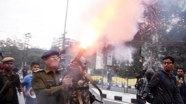 Police personnel fire tear gas during a protest against the Citizenship (Amendment) Bill 2019, in Guwahati on Wednesday. (ANI Photo) Police personnel fire tear gas during a protest against the Citizenship (Amendment) Bill 2019, in Guwahati on Wednesday. (ANI Photo)