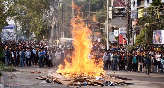 Protesters burn wooden hoardings during a protest against the Citizenship (Amendment) Bill 2019, in Guwahati. Chidambaram charged the government with “wrecking and demolishing” the Constitution and expressed confidence that the judiciary would strike down the law. “This [bill] is a slap on the face of Parliament... I am afraid this government is ramming through this bill in order to advance its Hindutva agenda,” he said. (ANI)
