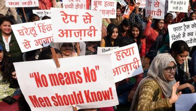 Supporters hold placards to show solidarity with Delhi Commission for Women (DCW) chairperson Swati Maliwal over demand for capital punishment for the all rape-murder suspects within six months of their conviction in New Delhi on December 06, 2019.(Sonu Mehta/HT PHOTO)