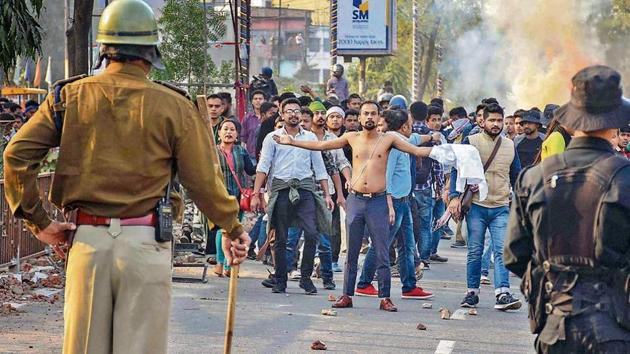 Protestors, amid tear-smoke clash with the police during their march against the Citizenship (Amendment) Bill, 2019, in Guwahati, Wednesday, Dec. 11, 2019.(Photo: PTI)