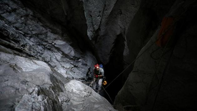 A member of the Middle East Caving and Expeditionary Team descends while exploring Birdwing cave, the deepest in the Gulf, on Jebel Kawr near Ibri, Oman. (Christopher Pike / REUTERS)