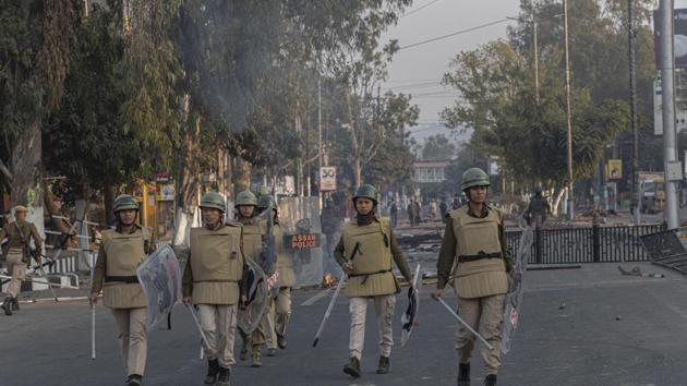 Assam police women patrol during a curfew in Guwahati.(AP)