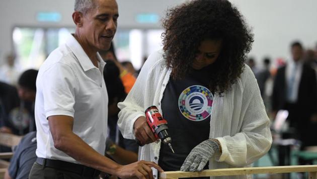 Former US president Barack Obama (L) and wife Michelle Obama (R) attend a side event for the Obama Foundation in Kuala Lumpur. (Mohd RASFAN / AFP)