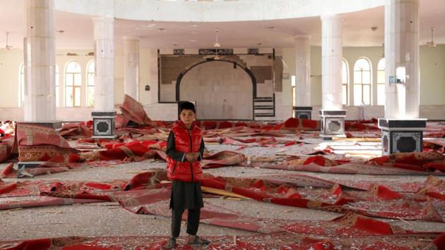 An Afghan boy stands inside a damaged mosque at the site of an attack in a U.S. military air base in Bagram, north of Kabul, Afghanistan. (Mohammad Ismail / REUTERS)