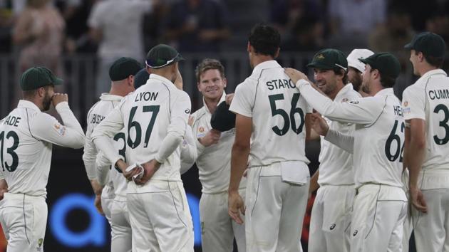 Steve Smith, center without cap, is congratulated by teammates after taking the catch to dismiss New Zealand's Kane Williamson. (AP) Steve Smith, center without cap, is congratulated by teammates after taking the catch to dismiss New Zealand's Kane Williamson. (AP)