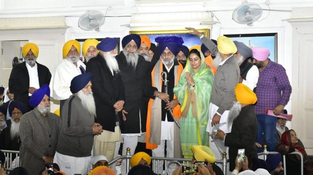 Shiromani Akali Dal president Sukhbir Singh Badal (centre) with wife and Union minister Harsimrat Kaur Badal being congratulated by party delegates after his re-election for the third time at the Teja Singh Samundri Hall in Amritsar on Saturday afternoon. (Sameer Sehgal/HT) Shiromani Akali Dal president Sukhbir Singh Badal (centre) with wife and Union minister Harsimrat Kaur Badal being congratulated by party delegates after his re-election for the third time at the Teja Singh Samundri Hall in Amritsar on Saturday afternoon. (Sameer Sehgal/HT)