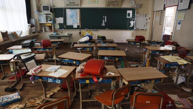 An abandoned elementary school classroom is cluttered with school bags and other belongings left by students as they rushed out after the March 2011 earthquake and tsunami that crippled the nearby Fukushima nuclear power plant. Next year, Olympic baseball and softball will be played in one part of Fukushima, allowing Tokyo organizers and the Japanese government to label these games the “Recovery Olympics.” The symbolism recalls the 1964 Tokyo Olympics, which showcased Japan’s reemergence just 19 years after World War II. (Jae C. Hong / AP)