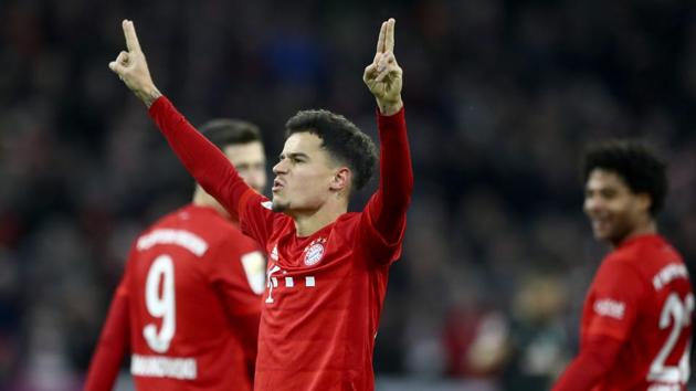 Bayern's scorer Philippe Coutinho, front, celebrates after scoring his side's sixth goal.(AP)