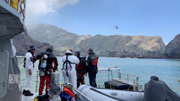 Police divers prepare to search the waters near White Island off the coast of Whakatane, New Zealand, Saturday Dec. 14, 2019. (AP) Police divers prepare to search the waters near White Island off the coast of Whakatane, New Zealand, Saturday Dec. 14, 2019. (AP)