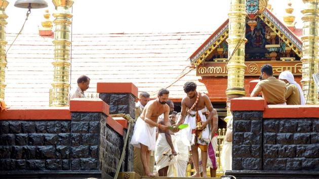 Men at work at the main temple complex of Sabarimala temple, in Kerala in November 2019. (Photo by Vivek Nair / Hindustan Times) Men at work at the main temple complex of Sabarimala temple, in Kerala in November 2019. (Photo by Vivek Nair / Hindustan Times)