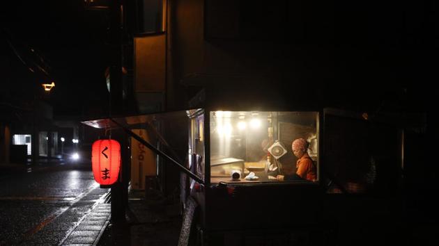 Yakitory cook Akemi Kumagai works in her shack in Hirono.The number of residents registered in the town has decreased by more than 1,000 since the accident, indicating they are unlikely to return. “It was so sad to see the town destroyed and my hometown lost,” he said, holding back tears. He reflected on family life, the autumn leaves and the comforting hot baths. (Jae C. Hong / AP)