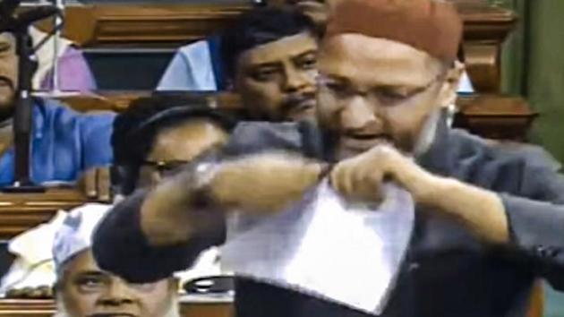 AIMIM chief and Hyderabad MP Asaduddin Owaisi tears a copy of the Citizenship Amendment Bill while speaking in the Lok Sabha during the Winter Session of Parliament, in New Delhi.(PTI)