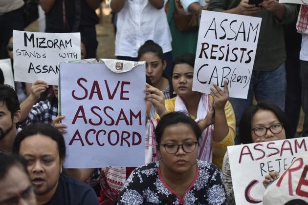 People from Assam hold placards during a protest against the Citizenship Act at Azad Maidan in Mumbai on Saturday. (Kunal Patil/HT Photo) People from Assam hold placards during a protest against the Citizenship Act at Azad Maidan in Mumbai on Saturday. (Kunal Patil/HT Photo)