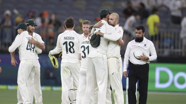 Australian bowlers Mitchell Starc and Nathan Lyon hug after winning their cricket test against New Zealand in Perth.(AP) Australian bowlers Mitchell Starc and Nathan Lyon hug after winning their cricket test against New Zealand in Perth.(AP)