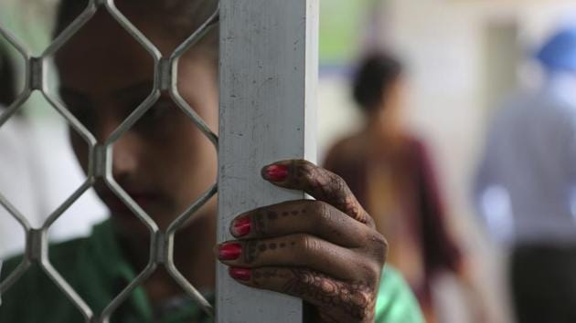 A recovering tramadol addict waits for her medication at a de-addiction centre in Kapurthala. This year, authorities seized hundreds of thousands of tablets, banned most pharmacy sales and shut down pill factories, pushing the price from 35 cents for a 10-pack to $14. The government opened a network of treatment centers, fearing those who had become opioid addicted would resort to heroin out of desperation. (Channi Anand / AP)