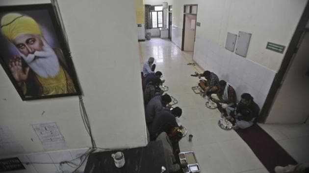 Recovering addicts eat a meal at a de-addiction centre. The UN established the International Narcotics Control Board in 1961 to spare the world the “serious evil” of addiction. It has since tracked most opioids. Tramadol’s exemption and its easy availability also leads to confusion about what tramadol even is. In many countries, it is thought to be a mood enhancer or treatment for depression and post-traumatic stress. (Channi Anand / AP)