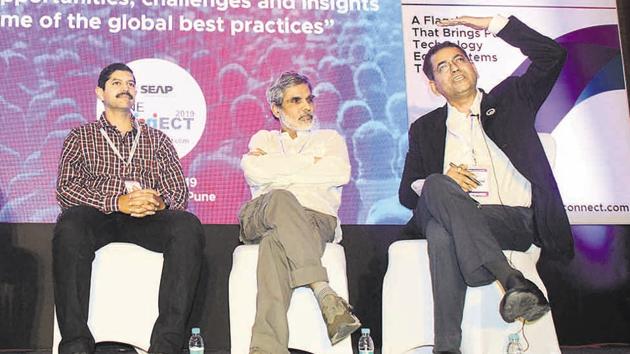 (From left to right) Aditya Abhyankar, Parag Kulkarni and Milind Pande during the inaugural ceremony of the 8th edition ‘Pune Connect 2019’, at Hyatt Regency on Saturday.(Shankar Narayan/HT PHOTO)