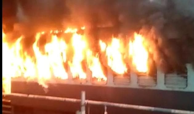 A train is set on fire in Bengal. At Krishnapur station in Murshidabad, an irate mob torched at least four trains and ransacked the railway complex. (HT Photo) A train is set on fire in Bengal. At Krishnapur station in Murshidabad, an irate mob torched at least four trains and ransacked the railway complex. (HT Photo)