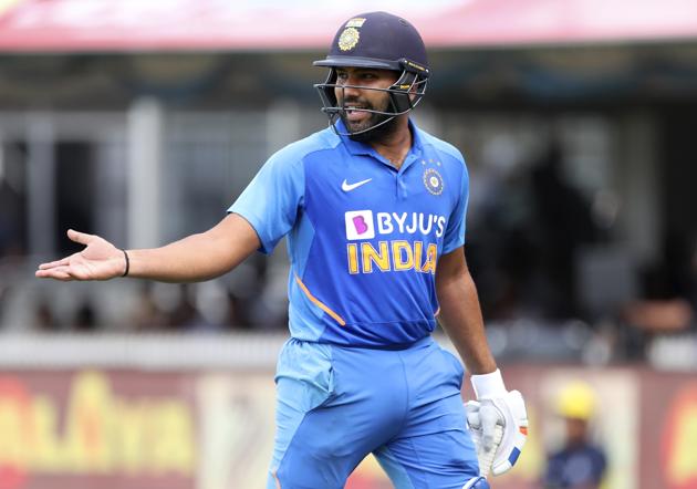 Rohit Sharma gestures to his teammate Rishabh Pant as he leaves the field after being dismissed by West Indies' Alzarri Joseph. (AP)