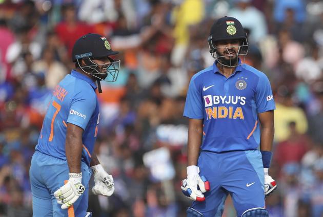 Shreyas Iyer, right, and batting partner Rishabh Pant share a light moment. (AP)