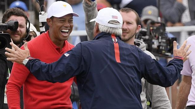U.S. team player and captain Tiger Woods, left, celebrates with vice captain Fred Couples(AP) U.S. team player and captain Tiger Woods, left, celebrates with vice captain Fred Couples(AP)