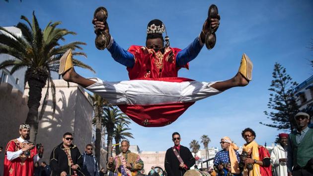 In a riot of colour, acrobatics and drum beats, Morocco’s gnawa artists joyously celebrated the inclusion of their ancient art-form in UNESCO’s list of Intangible Cultural Heritage of Humanity. Troupes of the artists in traditional costumes paraded through the white-and-blue citadel town of Essaouira in southern Morocco Saturday, the sound of their lute strings and steel castanets filling the streets. (Fadel Senna / AFP) In a riot of colour, acrobatics and drum beats, Morocco’s gnawa artists joyously celebrated the inclusion of their ancient art-form in UNESCO’s list of Intangible Cultural Heritage of Humanity. Troupes of the artists in traditional costumes paraded through the white-and-blue citadel town of Essaouira in southern Morocco Saturday, the sound of their lute strings and steel castanets filling the streets. (Fadel Senna / AFP)