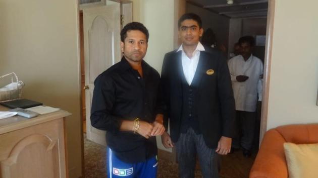 File photo of Sachin Tendulkar with Taj hotel worker Guruprasad.(Twitter)