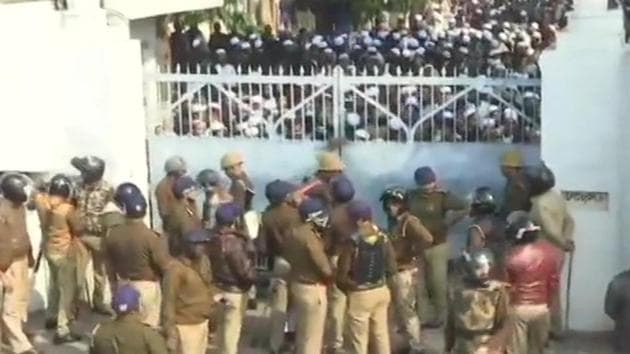 Police close gate of Nadwa college where students protested against the new citizenship law.(ANI Photo)