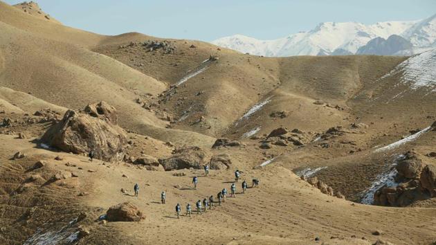 Deminers scan a Soviet-era combat zone at Ahangaran in Bamiyan, Afghanistan. Gholam Mahaiuddin sighs softly as he thinks of his 14-year-old son, killed by a bomb dropped last century in the hills of Bamiyan. “We knew the mountain was dangerous,” said Mahaiuddin, who found his son’s remains after he didn’t come home one day. “We were aware of mines but we could not find them. They were buried in the soft sand after the rain.” (Mohammad Ali Shaida / AFP) Deminers scan a Soviet-era combat zone at Ahangaran in Bamiyan, Afghanistan. Gholam Mahaiuddin sighs softly as he thinks of his 14-year-old son, killed by a bomb dropped last century in the hills of Bamiyan. “We knew the mountain was dangerous,” said Mahaiuddin, who found his son’s remains after he didn’t come home one day. “We were aware of mines but we could not find them. They were buried in the soft sand after the rain.” (Mohammad Ali Shaida / AFP)