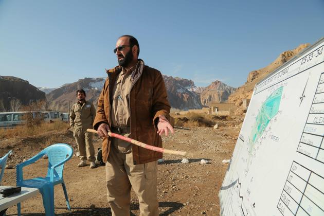 A team is briefed as they scan a combat zone dating back to the Soviet invasion. “It is the most dangerous, it is very sensitive to vibrations,” said Bachir Ahmad, who heads a team of deminers from the Danish Demining Group (DDG). The humanitarian organisation has been working in several Afghan provinces since 1999 to clear explosives left from a war most of the country’s current, young population never lived through. (AFP) A team is briefed as they scan a combat zone dating back to the Soviet invasion. “It is the most dangerous, it is very sensitive to vibrations,” said Bachir Ahmad, who heads a team of deminers from the Danish Demining Group (DDG). The humanitarian organisation has been working in several Afghan provinces since 1999 to clear explosives left from a war most of the country’s current, young population never lived through. (AFP)