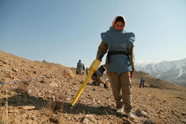 At the site near Ahangaran, deminers worked under a bright blue sky, with a doctor and team leader always on hand. The team of eight, wearing bright blue body armour, picked quietly at the ground, their silence broken only by the sound of crows crying and metal detectors buzzing. Zarkha, 26, said she had found her first cluster bomb a few days earlier. “I was very scared,” she said. (AFP) At the site near Ahangaran, deminers worked under a bright blue sky, with a doctor and team leader always on hand. The team of eight, wearing bright blue body armour, picked quietly at the ground, their silence broken only by the sound of crows crying and metal detectors buzzing. Zarkha, 26, said she had found her first cluster bomb a few days earlier. “I was very scared,” she said. (AFP)