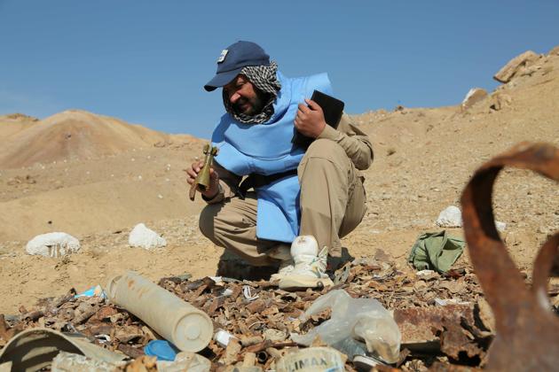 An Afghan deminer holds a mortar bomb during the scanning of a combat zone. Ahmad, the demining team leader, said he was angry his country remained devastated by the Soviet war. “They destroyed our lives. Because of them we have to do demining instead of being a doctor or engineer or teacher,” he said, adding that he had been demining since 2003 and was bored with the tedious work. (AFP) An Afghan deminer holds a mortar bomb during the scanning of a combat zone. Ahmad, the demining team leader, said he was angry his country remained devastated by the Soviet war. “They destroyed our lives. Because of them we have to do demining instead of being a doctor or engineer or teacher,” he said, adding that he had been demining since 2003 and was bored with the tedious work. (AFP)