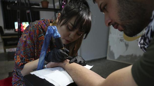 It’s been 18 months since tattoo artist Suraya Shaheedi, 26 started her mobile tattoo shop in the capital, Kabul. She’s received death threats for taking on the taboo of the ink-on-skin drawings she does — as well as being a single woman willing to work with men.(AP) It’s been 18 months since tattoo artist Suraya Shaheedi, 26 started her mobile tattoo shop in the capital, Kabul. She’s received death threats for taking on the taboo of the ink-on-skin drawings she does — as well as being a single woman willing to work with men.(AP)