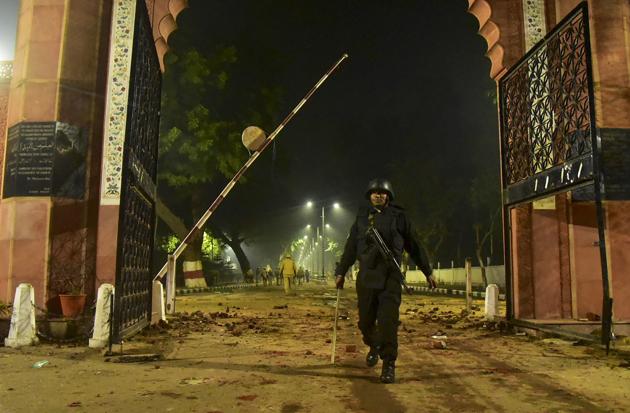 Security personnel stands guard near Aligarh Muslim University after violent protests against the Citizenship Amendment Act in Aligarh. (PTI) Security personnel stands guard near Aligarh Muslim University after violent protests against the Citizenship Amendment Act in Aligarh. (PTI)