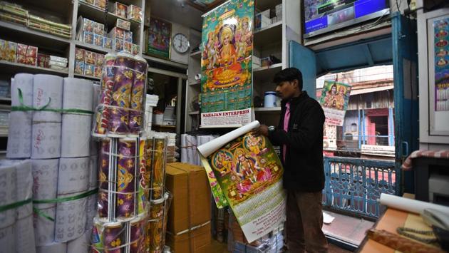 Back at Subhash Calendar Co at Nai Sarak, in the span of a conversation, a customer asks 5000 calendars featuring Ram Darbar. Gilotra check his stock, puts up his price, and the order is fulfilled within minutes. Another customer from Bihar comes in and asks for 10,000 Krishna calendar. “You see, a calendar has both religious and ornamental significance. It will never be outdated,” says Gilotra. (Raj K Raj / HT Photo)
