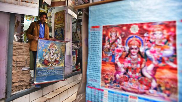 Calendars are seen hanging at Sadar Bazar. Original calendar art and calendars are fast becoming collectibles. An online platform Kalakriti sells original paintings by celebrated calendar artists. The works of SM Pandit and C Kondiah Raju, fetch anything between Rs 2 lakh to 2.5 lakh. “The government should take steps to preserve their artwork, which are an important part of our country’s mass culture,” says Rahul Rajora, its founder. (Raj K Raj / HT Photo)