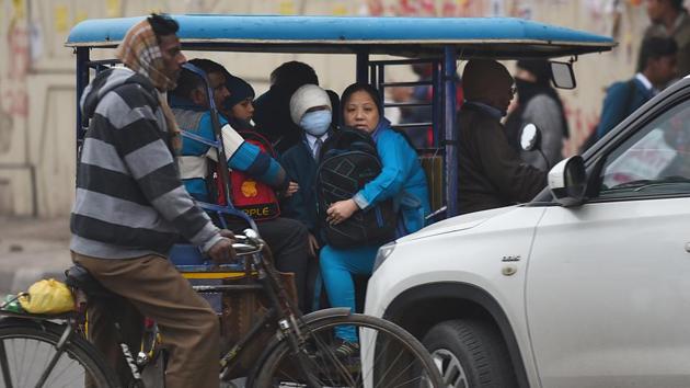 A child is seen wearing warm clothes while going to school, along with other commuters, on a winter morning, at Pandav Nagar. (Raj K Raj/HT PHOTO) A child is seen wearing warm clothes while going to school, along with other commuters, on a winter morning, at Pandav Nagar. (Raj K Raj/HT PHOTO)