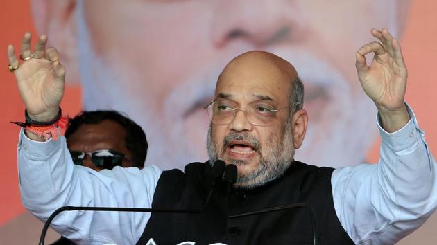 Union Home Affairs Minister and BJP National President Amit Shah addresses during an election campaign rally, in support of BJP candidate from Barharwah assembly constituency Beni Prasad Gupta, ahead of the fifth phase State Assembly Elections-2019 in Pakur. (PTI) Union Home Affairs Minister and BJP National President Amit Shah addresses during an election campaign rally, in support of BJP candidate from Barharwah assembly constituency Beni Prasad Gupta, ahead of the fifth phase State Assembly Elections-2019 in Pakur. (PTI)