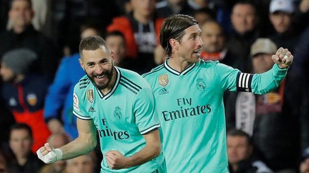 Real Madrid's Karim Benzema celebrates scoring their first goal with Sergio Ramos(REUTERS)