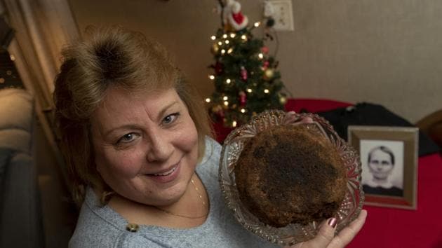Julie Ruttinger, holds a 141-year-old fruitcake, a family heirloom baked by her great-great-grandmother, Fidelia Ford, in 1878. (AP) Julie Ruttinger, holds a 141-year-old fruitcake, a family heirloom baked by her great-great-grandmother, Fidelia Ford, in 1878. (AP)