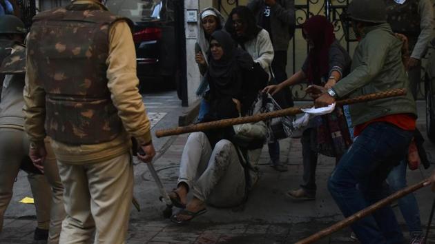 Cops use baton on protesters during the protest over the citizenship act in New Delhi on Sunday.(ANI photo)