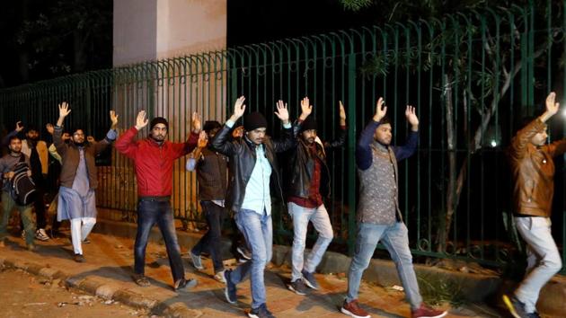 Students raising their hands leave the Jamia Milia University following a protest against a new citizenship law in New Delhi December 15, 2019. (REUTERS) Students raising their hands leave the Jamia Milia University following a protest against a new citizenship law in New Delhi December 15, 2019. (REUTERS)