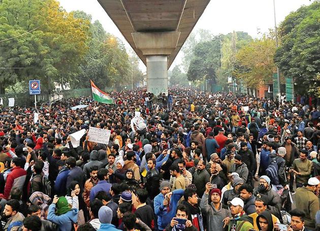 Demonstrators outside Jamia Millia Islamia on Monday. (REUTERS) Demonstrators outside Jamia Millia Islamia on Monday. (REUTERS)