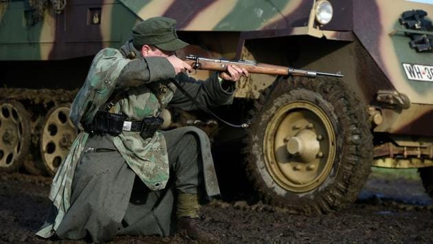 At dawn on Dec. 16, 1944, over 200,000 German soldiers started the most unexpected breakthrough through the dense woods of Belgium and Luxembourg’s hilly Ardennes. Making the most of the surprise move, the cold, freezing weather and wearied U.S. troops, the Germans pierced the front line so deeply it came to be known as the Battle of the Bulge. (John Thys / AFP) At dawn on Dec. 16, 1944, over 200,000 German soldiers started the most unexpected breakthrough through the dense woods of Belgium and Luxembourg’s hilly Ardennes. Making the most of the surprise move, the cold, freezing weather and wearied U.S. troops, the Germans pierced the front line so deeply it came to be known as the Battle of the Bulge. (John Thys / AFP)