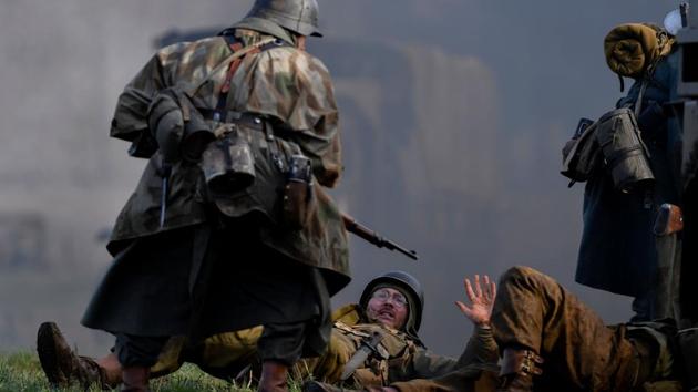 When Brig. Gen. Anthony C. McAuliffe of the 101st Airborne received a December 22 ultimatum to surrender or face total destruction, he offered one of the most famous and brief replies in military history: “Nuts”. Four days later, US troops broke the Nazi encirclement. After the fighting in the Battle of the Bulge ended on January 28, 1945, Allied forces invaded Germany, eventually leading to the Nazi surrender and the end of the war in Europe. (John Thys / AFP) When Brig. Gen. Anthony C. McAuliffe of the 101st Airborne received a December 22 ultimatum to surrender or face total destruction, he offered one of the most famous and brief replies in military history: “Nuts”. Four days later, US troops broke the Nazi encirclement. After the fighting in the Battle of the Bulge ended on January 28, 1945, Allied forces invaded Germany, eventually leading to the Nazi surrender and the end of the war in Europe. (John Thys / AFP)