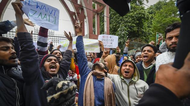 Protestors, including students and local residents hold placards during a demonstration against the Citizenship Amendment Act (CAA), outside Jamia Millia Islamia University in New Delhi, Tuesday, Dec. 17, 2019.(PTI) Protestors, including students and local residents hold placards during a demonstration against the Citizenship Amendment Act (CAA), outside Jamia Millia Islamia University in New Delhi, Tuesday, Dec. 17, 2019.(PTI)