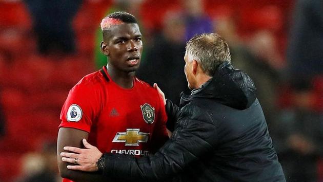 Manchester United manager Ole Gunnar Solskjaer shakes hands with Paul Pogba. (Action Images via Reuters) Manchester United manager Ole Gunnar Solskjaer shakes hands with Paul Pogba. (Action Images via Reuters)